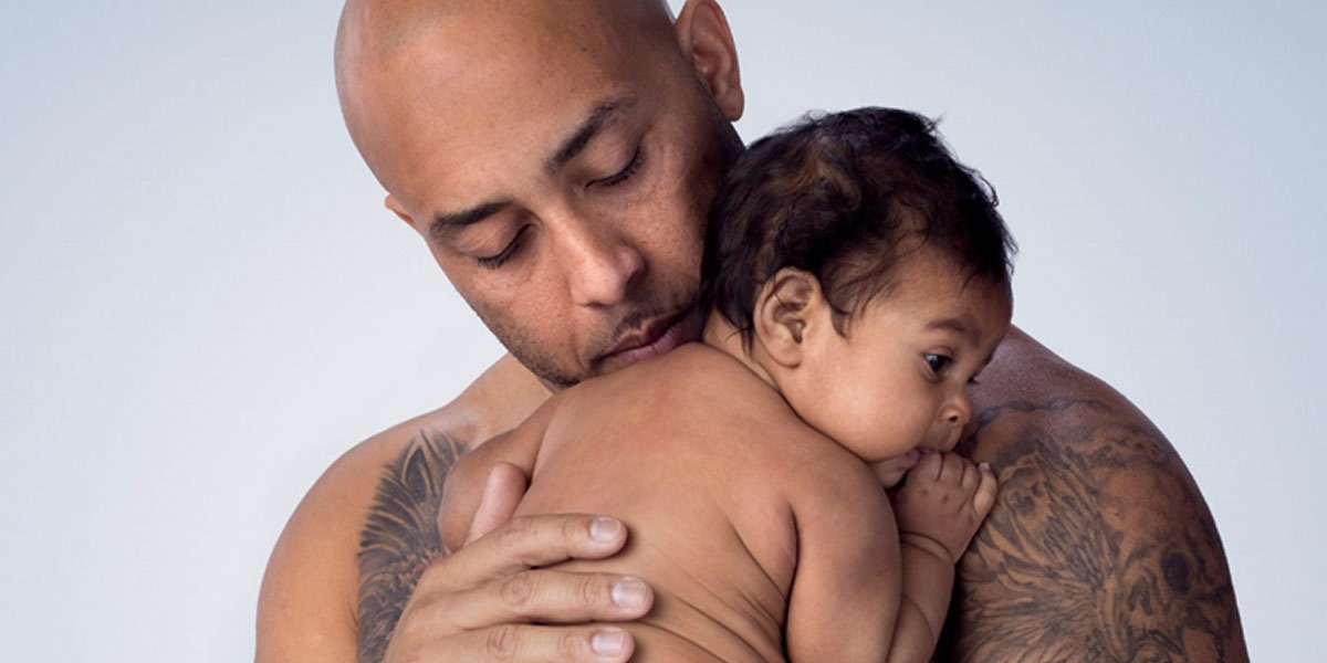 Loving dad holding a baby