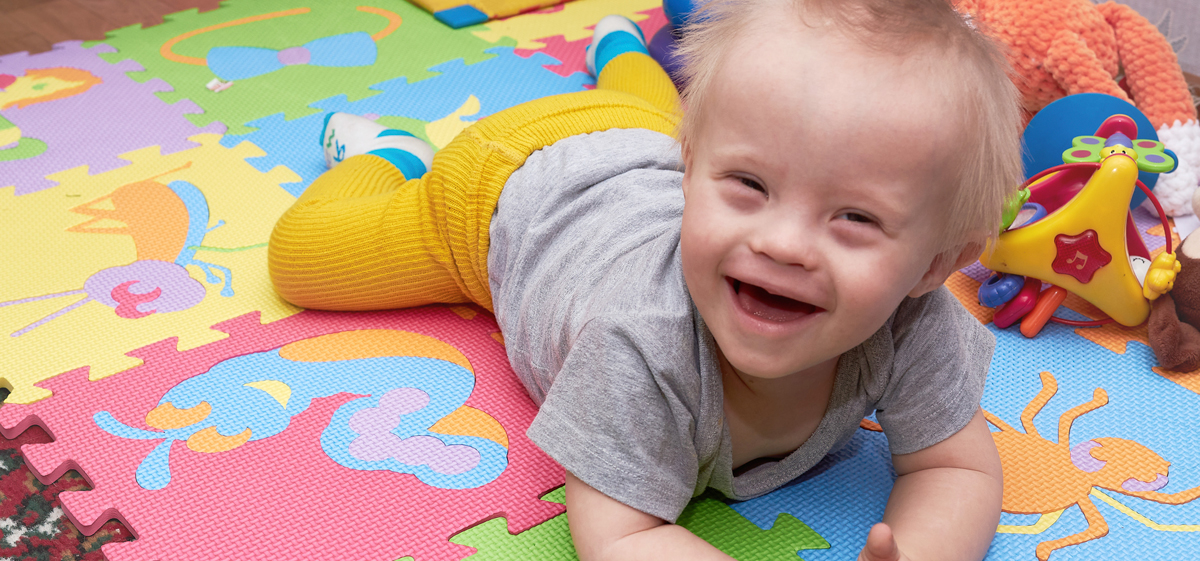 Happy baby smiling on mat